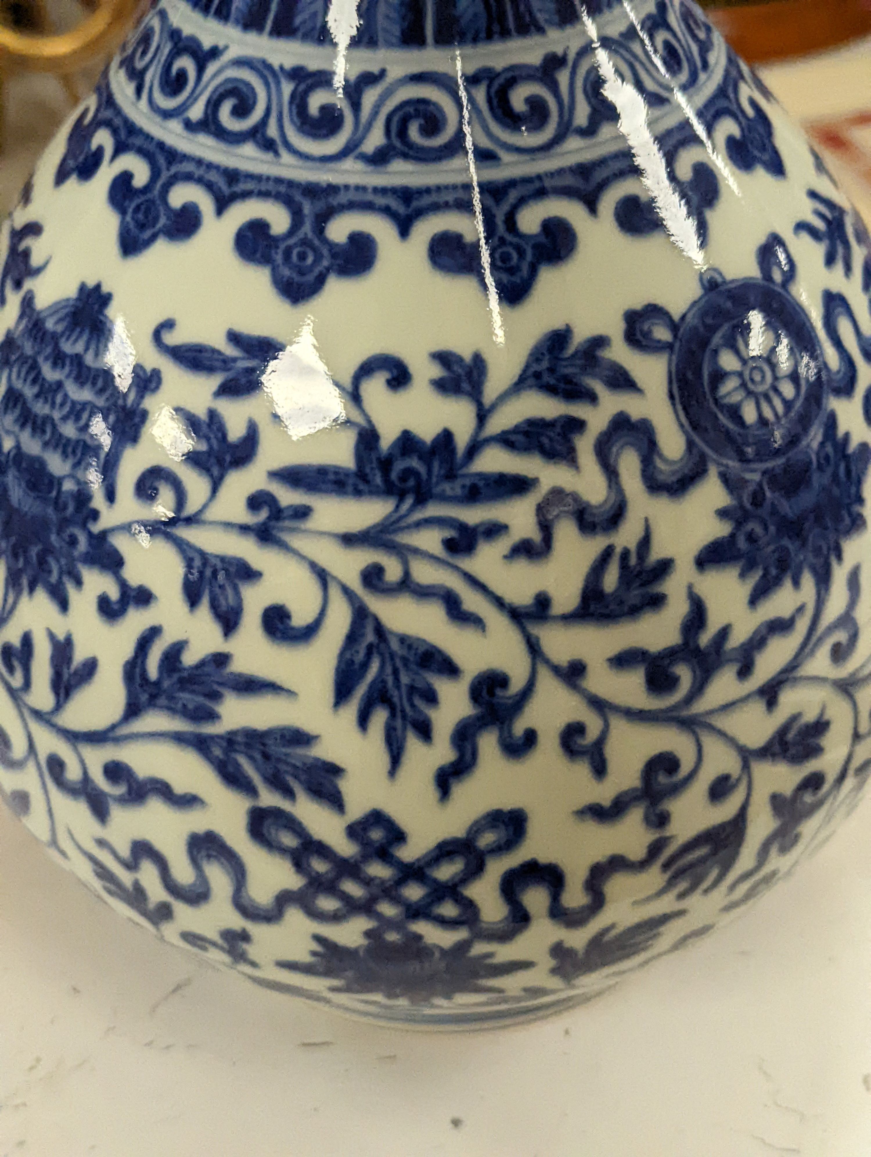 A Chinese blue and white Ming style 'lotus' vase, Yuhuchunping, Qianlong seal mark but 19th century - 28cm high